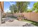 Backyard oasis featuring a large patio, low maintenance artificial turf and mature trees at 9223 E Camino Del Santo --, Scottsdale, AZ 85260