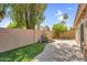 Backyard featuring lush landscaping, low maintenance artificial turf and a block wall at 9223 E Camino Del Santo --, Scottsdale, AZ 85260