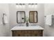 Bathroom features a double sink vanity, framed mirrors, and modern lighting at 9223 E Camino Del Santo --, Scottsdale, AZ 85260
