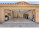 Large, empty two car garage with storage cabinets at 9223 E Camino Del Santo --, Scottsdale, AZ 85260