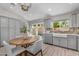 Bright kitchen features gray cabinets, stainless steel appliances, and a farmhouse sink at 9223 E Camino Del Santo --, Scottsdale, AZ 85260