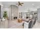 Bright living room features a stone fireplace, ceiling fan and neutral furniture at 9223 E Camino Del Santo --, Scottsdale, AZ 85260