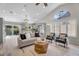 Bright living room features vaulted ceilings, neutral furniture, and backyard views at 9223 E Camino Del Santo --, Scottsdale, AZ 85260
