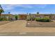 Inviting single-story home featuring a carport and low-maintenance desert landscaping at 9707 W Lancaster Dr, Sun City, AZ 85351