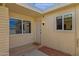 Welcoming front entrance with neutral colors and 'welcome' mat at 9707 W Lancaster Dr, Sun City, AZ 85351