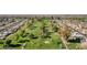 Overhead view of the golf course amidst residential houses, showcasing the community's recreational space at 9707 W Lancaster Dr, Sun City, AZ 85351
