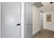 Hallway with white walls, gray trim and modern doors at 9707 W Lancaster Dr, Sun City, AZ 85351