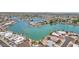 Scenic aerial shot of a waterfront community showcasing a large lake and beautiful landscaping at 9707 W Lancaster Dr, Sun City, AZ 85351