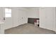 Clean laundry room with exterior door, storage, and easy-to-maintain concrete floors at 9707 W Lancaster Dr, Sun City, AZ 85351