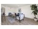 Open living room features wood-look floors, modern decor, and neutral colors at 9707 W Lancaster Dr, Sun City, AZ 85351