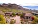 Exclusive desert home features a red-tiled roof, desert landscaping and a mountain backdrop, offering privacy at 9820 E Thompson Peak Pkwy # 628, Scottsdale, AZ 85255