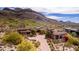Aerial view of houses with red tile roofs and desert landscaping near a golf course at 9820 E Thompson Peak Pkwy # 628, Scottsdale, AZ 85255