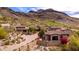 Luxury home features red tile roof, mountain views, and desert landscaping in a serene, upscale neighborhood at 9820 E Thompson Peak Pkwy # 628, Scottsdale, AZ 85255