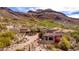 Beautiful aerial view of the house and its desert surroundings, with a nearby golf course at 9820 E Thompson Peak Pkwy # 628, Scottsdale, AZ 85255
