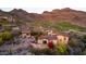 Beautiful desert home with red tile roof, landscaped grounds, and scenic mountain views, seamlessly blending luxury at 9820 E Thompson Peak Pkwy # 628, Scottsdale, AZ 85255