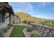 Expansive backyard featuring synthetic grass, desert landscaping, and stunning mountain views at 9820 E Thompson Peak Pkwy # 628, Scottsdale, AZ 85255