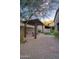 Serene backyard patio with a pergola, seating area, and lush landscaping, creating a relaxing outdoor retreat at 9820 E Thompson Peak Pkwy # 628, Scottsdale, AZ 85255