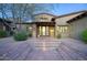 Home featuring a brick entrance with tiled steps and desert landscaping, enhanced by an inviting front door at 9820 E Thompson Peak Pkwy # 628, Scottsdale, AZ 85255