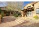 Charming courtyard entrance with brick steps and desert landscaping leading to the front door at 9820 E Thompson Peak Pkwy # 628, Scottsdale, AZ 85255