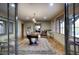 Expansive game room with a foosball table, hardwood floors, and floor to ceiling windows at 9820 E Thompson Peak Pkwy # 628, Scottsdale, AZ 85255