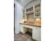 Charming home office with wooden desktop, custom cabinetry, and ample storage for books at 9820 E Thompson Peak Pkwy # 628, Scottsdale, AZ 85255