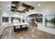 The open floorplan showcases a kitchen with a large center island, beamed ceilings, and views to the living room and dining room at 9820 E Thompson Peak Pkwy # 628, Scottsdale, AZ 85255