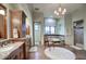 Luxurious main bathroom featuring a soaking tub, double vanities, and a walk-in shower at 9820 E Thompson Peak Pkwy # 628, Scottsdale, AZ 85255
