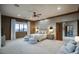 Inviting main bedroom with serene decor, plush seating, and scenic views from large windows at 9820 E Thompson Peak Pkwy # 628, Scottsdale, AZ 85255