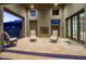 Inviting outdoor living space featuring a cozy fireplace, comfortable seating, and a tiled floor, perfect for entertaining at 9820 E Thompson Peak Pkwy # 628, Scottsdale, AZ 85255