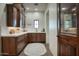Walk-in pantry features custom wood cabinetry and an espresso machine at 9820 E Thompson Peak Pkwy # 628, Scottsdale, AZ 85255
