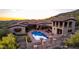 Aerial view of a backyard with a pool and well landscaped outdoor living space at 9820 E Thompson Peak Pkwy # 628, Scottsdale, AZ 85255