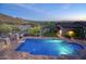 An aerial view of a pool, lush landscaping, and an outdoor living space at 9820 E Thompson Peak Pkwy # 628, Scottsdale, AZ 85255