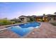 Beautiful swimming pool with a diving board, lush landscaping, and backyard home view at 9820 E Thompson Peak Pkwy # 628, Scottsdale, AZ 85255