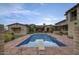 Beautiful swimming pool with a diving board, stunning landscaping, and back of home at 9820 E Thompson Peak Pkwy # 628, Scottsdale, AZ 85255