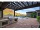 Outdoor kitchen with stainless steel BBQ situated near the refreshing pool with mountain views at 9820 E Thompson Peak Pkwy # 628, Scottsdale, AZ 85255
