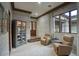 Cozy sitting room featuring elegant furnishings, natural light, and serene views of the exterior at 9820 E Thompson Peak Pkwy # 628, Scottsdale, AZ 85255