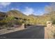 Scenic shot of a road leading to the property, with mountains in the background at 9820 E Thompson Peak Pkwy # 628, Scottsdale, AZ 85255