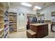 Spacious walk-in closet featuring custom shelving, cabinets, center island, and hanging racks for optimal storage and organization at 9820 E Thompson Peak Pkwy # 628, Scottsdale, AZ 85255