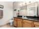 Bathroom features a granite vanity, tiled floor, and ample storage space for easy living at 10030 W Indian School Rd # 165, Phoenix, AZ 85037