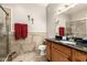 Bathroom features stylish tiled walls, glass shower, and spacious wooden vanity with granite counter at 10030 W Indian School Rd # 165, Phoenix, AZ 85037