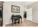 Bedroom with wood-look floors, a desk, and doorway to the kitchen at 10030 W Indian School Rd # 165, Phoenix, AZ 85037