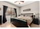 Cozy bedroom with large window and laminate flooring is an inviting and comfortable space at 10030 W Indian School Rd # 165, Phoenix, AZ 85037