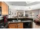 Open kitchen showcasing granite countertops and seamless flow to living areas at 10030 W Indian School Rd # 165, Phoenix, AZ 85037