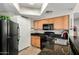 Efficient kitchen layout with modern appliances and ample counter space at 10030 W Indian School Rd # 165, Phoenix, AZ 85037