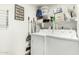 Bright laundry room featuring a washer, dryer, and storage shelves at 10030 W Indian School Rd # 165, Phoenix, AZ 85037