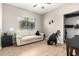 Bright living room with a large window, laminate floor and comfortable furniture for relaxation at 10030 W Indian School Rd # 165, Phoenix, AZ 85037