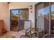 Outdoor patio seating area accessible through sliding glass doors at 10030 W Indian School Rd # 165, Phoenix, AZ 85037