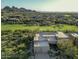 Stunning aerial view of a luxury home near golf course and beautiful mountains, desert landscape at 10795 E Sutherland Way, Scottsdale, AZ 85262