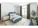 Stylish bedroom with a cozy rug and natural light at 10795 E Sutherland Way, Scottsdale, AZ 85262