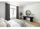 Well-lit bedroom with modern furnishings and a large window at 10795 E Sutherland Way, Scottsdale, AZ 85262